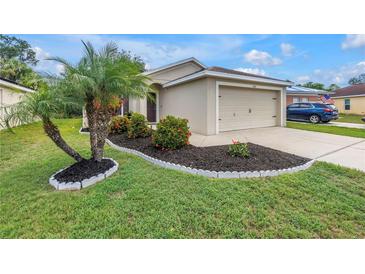 Charming single-story home featuring well-manicured lawn, flowerbeds, and a tasteful two-car garage at 3162 27Th E Ct, Palmetto, FL 34221