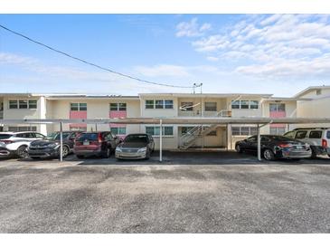 Exterior shot of condo building featuring covered parking at 2503 Beneva Rd # 7, Sarasota, FL 34232
