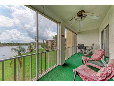 Relax on this screened balcony with outdoor seating and gorgeous views of the lake and green spaces at 3801 Lake Bayshore Dr # H413, Bradenton, FL 34205