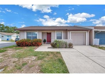Charming home featuring a well-kept lawn, colorful shrubbery, and a private driveway at 4116 43Rd W Ave, Bradenton, FL 34205