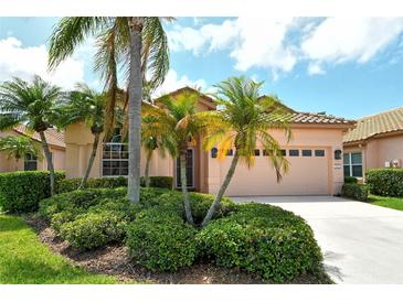 Charming single-story home with lush landscaping and a two-car garage at 3804 Amapola Ln, Sarasota, FL 34238