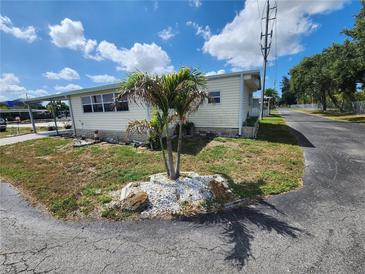 Attractive single-story home with a landscaped yard, showcasing a tranquil neighborhood setting at 5301 Algeria Ct, Bradenton, FL 34207