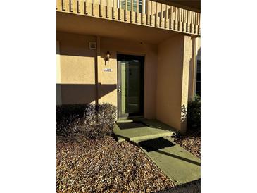 Inviting front door entrance with decorative address number and welcoming exterior lighting at 6108 7Th W Ave # 6108, Bradenton, FL 34209