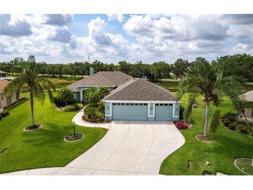 Inviting home with well-manicured lawn, lush landscaping, and a spacious three-car garage at 9017 Province St, Sarasota, FL 34240