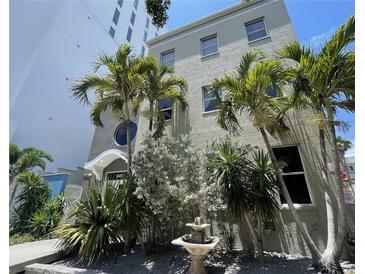 Beautiful building exterior featuring lush landscaping and a charming fountain near the entryway at 1345 2Nd St, Sarasota, FL 34236