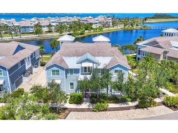 Charming two-story coastal home featuring a lake view and lush landscaping in a desirable neighborhood at 262 Sapphire Lake Dr # 202, Bradenton, FL 34209