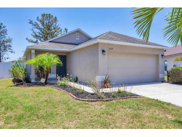 Charming single-story home features a well-manicured lawn, a two car garage, and lovely curb appeal at 3429 97Th E Ln, Palmetto, FL 34221