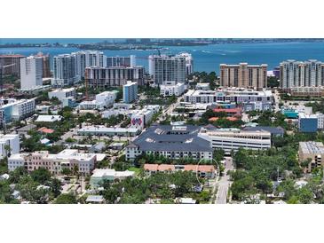 Stunning aerial view of a coastal community, showcasing city skyline and waterfront at 631 N Orange Ave # 208, Sarasota, FL 34236