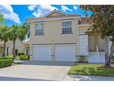 Charming two-story condo featuring a tile roof, a two car garage and a well maintained lawn in a great neighborhood at 6335 Bay Cedar Ln, Bradenton, FL 34203