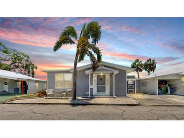 Charming single-story home with a well-manicured lawn and cozy outdoor seating area at 17 Braden Castle Dr, Bradenton, FL 34208