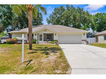 Charming single-story home with a well-maintained lawn and a two-car garage, perfect for Gathering living at 8638 Bessemer Ave, North Port, FL 34287