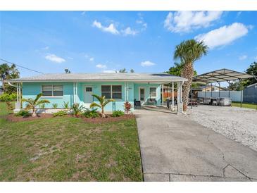 Charming single-story home featuring a well-manicured lawn and a convenient covered carport at 4519 Brooksdale Dr, Sarasota, FL 34232