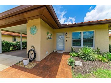 Charming front entrance with decorative details and terra cotta tile at 3213 Mercer Rd, Bradenton, FL 34207