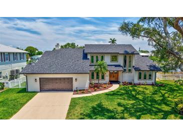 An aerial view of a beautiful two-story home with a well-manicured lawn and a two-car garage at 4506 17Th W St, Palmetto, FL 34221