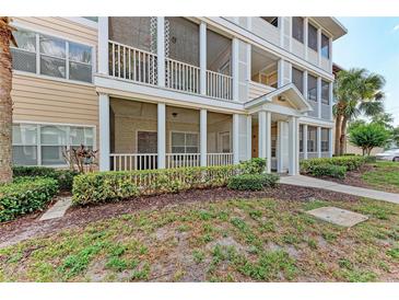 Inviting condo building with screened porches and lush landscaping offering a relaxed and comfortable living environment at 4802 51St W St # 808, Bradenton, FL 34210