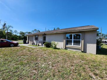 Charming single-story home with a well-maintained front yard, inviting entrance, and newer windows at 6405 Myrtlewood Rd, North Port, FL 34287