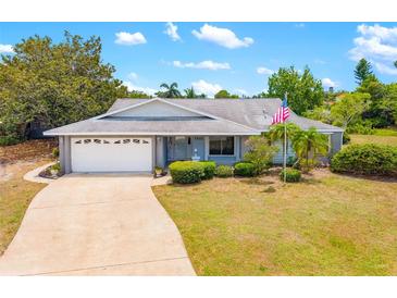 Charming single-story home featuring a well-maintained front yard, driveway, and attached garage at 7615 17Th W Ave, Bradenton, FL 34209