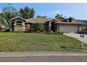 Charming one-story home with a well-manicured lawn and mature landscaping at 3110 57Th Avenue E Cir, Bradenton, FL 34203