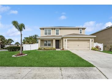 Inviting two-story home boasting a well-manicured lawn and attached two-car garage at 4005 Willow Branch Pl, Palmetto, FL 34221