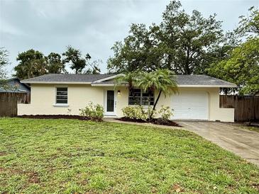 Charming single-story home with a well-maintained lawn and fresh landscaping at 4110 Longhorn Dr, Sarasota, FL 34233