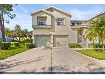 Charming two-story home with a well-maintained lawn and a two-car garage at 6310 Green Oak Cir, Bradenton, FL 34203