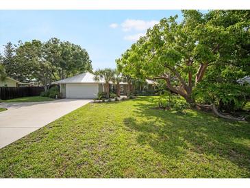Charming single story home with a metal roof and mature, well-maintained landscaping at 1207 71St Nw St, Bradenton, FL 34209
