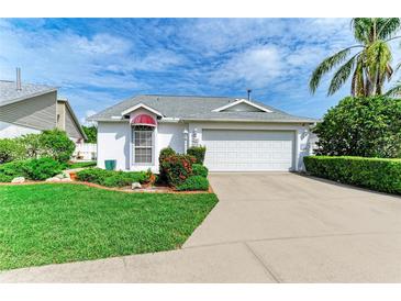 Charming home with well-manicured lawn, mature landscaping, and a two-car garage at 4227 Placid Dr, Sarasota, FL 34243