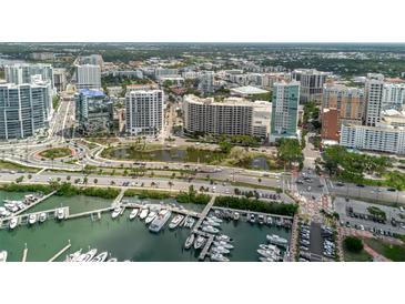 Stunning aerial view of the city, featuring the marina, waterfront, and cityscape at 1255 N Gulfstream Ave # 1104, Sarasota, FL 34236