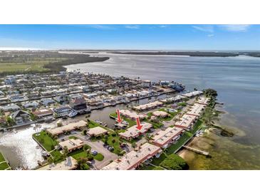 Wide aerial shot of a waterfront community with beautiful water views and private boat slips at 3876 Catalina Dr, Bradenton, FL 34210