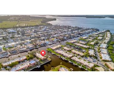 Waterfront community featuring charming homes with private boat docks along winding canals and easy access to the open bay at 4096 El Dorado Cv, Bradenton, FL 34210