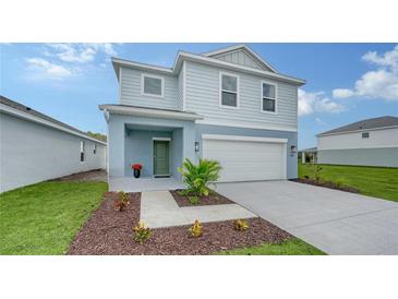 Charming two-story home with attached two car garage and front lawn landscaping at 13133 Bayberry Way, Parrish, FL 34219