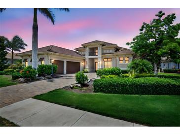 Stunning two-story home with well-manicured landscaping and a paved driveway at 4931 Benito Ct, Bradenton, FL 34211