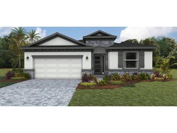 Charming single-Gathering home featuring a two-car garage, stone accents, and professionally landscaped front yard at 1749 Cobb Trl, Parrish, FL 34219