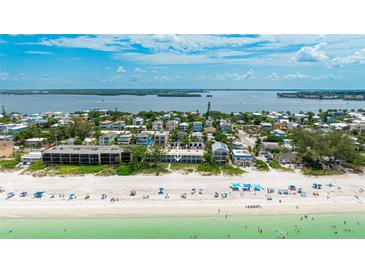 Gorgeous aerial view of beachfront condo with beach access and breathtaking gulf views at 2310 Gulf N Dr # 104, Bradenton Beach, FL 34217