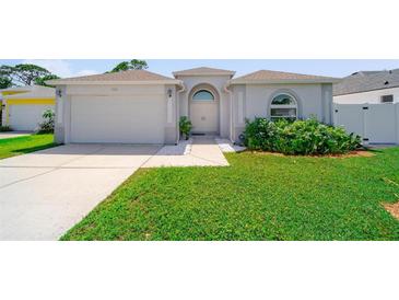 Charming single-story home featuring a well-maintained lawn and an attached two-car garage at 5410 Matthew Ct, Sarasota, FL 34231