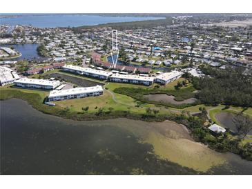 Waterfront condos with lush landscaping, ponds, and walking paths in a beautiful coastal community at 4832 Independence Dr, Bradenton, FL 34210