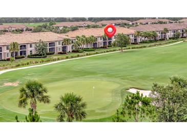 Scenic golf course view with lush green fairways and well-maintained landscaping surrounding the luxurious homes at 5528 Palmer Cir # 104, Bradenton, FL 34211