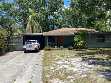Charming single-story home with a quaint front yard and covered parking, perfect for comfortable living at 2115 Temple St, Sarasota, FL 34239
