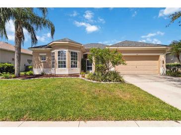 Charming single Gathering home featuring a manicured lawn and inviting curb appeal on a sunny day at 315 36Th Ne St, Bradenton, FL 34208