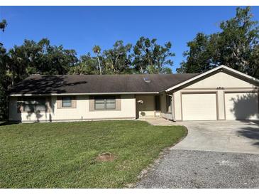 Charming one-story home featuring an attached two car garage, manicured lawn, and neutral paint scheme at 3804 65Th E St, Bradenton, FL 34208