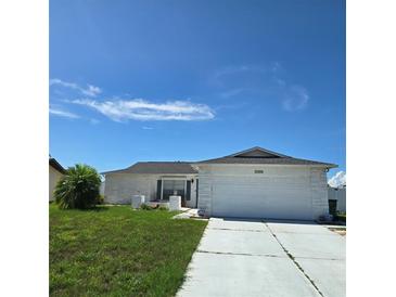 Charming single-story home featuring a two-car garage, well-maintained lawn, and bright, sunny curb appeal at 6406 16Th Avenue W Dr, Bradenton, FL 34209