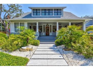 Charming two-story home with landscaped yard and inviting front porch at 1523 1St W Ave, Bradenton, FL 34205