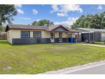 Charming single-story home with a well-maintained lawn and inviting front porch at 3211 Deerfield Dr, Tampa, FL 33619