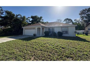 Charming single-story home with a well-maintained lawn and attached two-car garage at 4031 Wake Ave, Sarasota, FL 34241