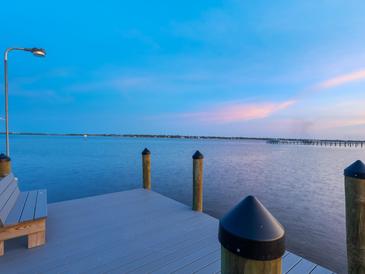 Stunning waterfront home features a private dock with picturesque sunset views at 355 Shore Dr, Ellenton, FL 34222