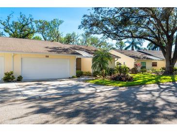 Charming villa with a well-manicured lawn and a two-car garage, perfect for easy living at 4279 Oakhurst E Cir # 3044, Sarasota, FL 34233