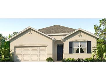 Beautiful single-story home showcasing a welcoming front entrance, two-car garage, and well-manicured landscaping at 4327 112Th E St, Palmetto, FL 34221