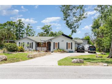 Charming single-story home with a stone-lined driveway and well-maintained landscaping at 9007 63Rd Avenue E Dr, Bradenton, FL 34202