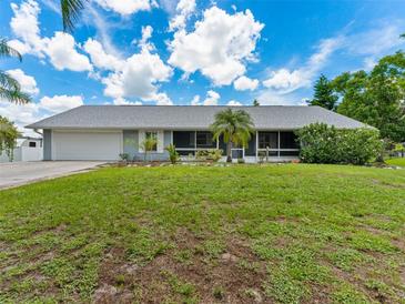 Charming single-story home with a well-maintained lawn, screened lanai, and a two-car garage at 601 136Th St E Ct, Bradenton, FL 34212