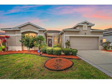 Charming single-Gathering home featuring manicured landscaping and a well-maintained lawn at 6266 Buckingham St, Sarasota, FL 34238